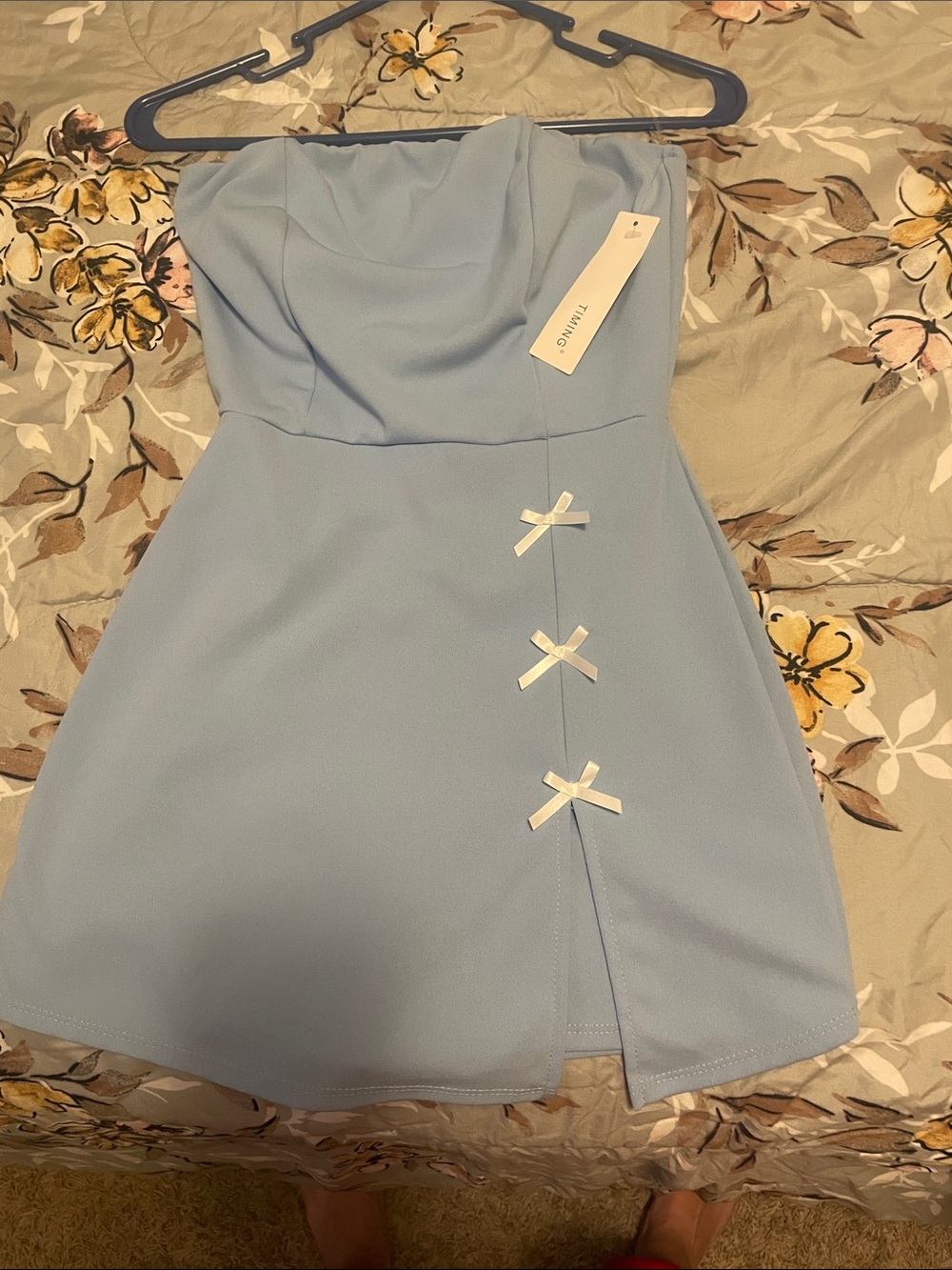 Timing Light Blue Strapless Mini Dress with White Bow Details. Built in shorts.